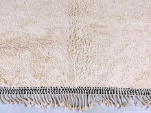 Load image into Gallery viewer, This beige wool rug captures the essence of Moroccan craftsmanship, offering a handmade, authentic addition to your decor.
