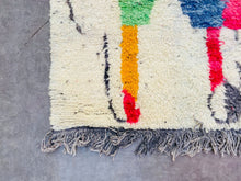 Load image into Gallery viewer, Close-up of the Colorful Berber rug, highlighting the depth of colors and the fluffy, high-quality wool texture.
