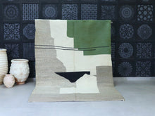 Load image into Gallery viewer, Handmade Moroccan rug in Beni Ourain style with black tribal designs on white wool, ideal for minimalist living rooms or nurseries


