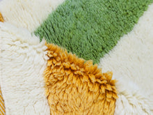 Load image into Gallery viewer, Playful custom Berber rug with navy, mustard, and green


