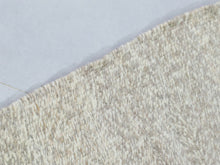 Load image into Gallery viewer, White Moroccan wool rug showcasing traditional handmade craftsmanship, styled in a clean, artistic room


