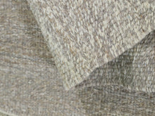 Load image into Gallery viewer, Custom Moroccan wool rug placed in a nursery setting, perfect for warm and textured baby room decor



