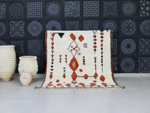 Load image into Gallery viewer, Handmade Moroccan Beni Ourain rug with tribal motifs.

