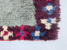 Load image into Gallery viewer, Boucherouite rug in multicolor tones and bold diamond shapes.
