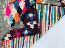 Load image into Gallery viewer, Unique eco-friendly Moroccan rug crafted from recycled textiles.
