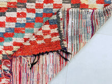 Load image into Gallery viewer, Red and beige handmade Moroccan wool rug with soft blue accents.
