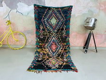 Load image into Gallery viewer, Vibrant Moroccan Boucherouite rug with colorful geometric patterns.
