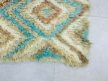 Load image into Gallery viewer, Beautiful Berber-style rug with soft turquoise and beige tones.
