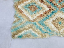 Load image into Gallery viewer, Handmade Moroccan wool rug with a bohemian and eclectic feel.
