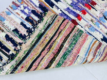 Load image into Gallery viewer, Artisan-made Moroccan rug showcasing vivid hues and sustainable materials.
