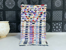 Load image into Gallery viewer, Handmade Moroccan Boucherouite rug with vibrant colors and a unique patchwork design.
