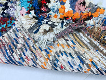 Load image into Gallery viewer, Eclectic handmade rug showcasing bright recycled fabric pieces.
