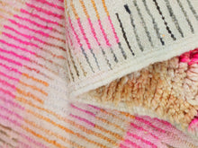 Load image into Gallery viewer, Close-up of the vibrant texture of the Moroccan wool rug.
