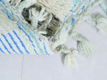 Load image into Gallery viewer, Close-up of a handmade Moroccan wool rug showcasing intricate pastel designs.
