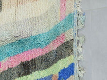 Load image into Gallery viewer, Close-up details of the wool texture and pastel design of the Moroccan rug.
