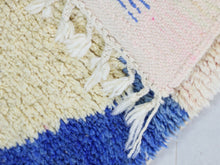 Load image into Gallery viewer, Close-up of soft wool texture in abstract blue and beige designs.
