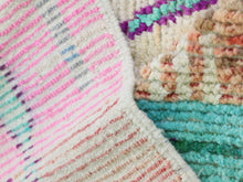 Load image into Gallery viewer, Soft wool rug showcasing a lively pink and green boho design.
