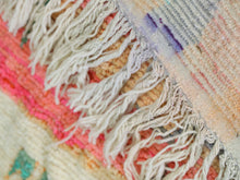 Load image into Gallery viewer, Close-up of the intricate details on a colorful Moroccan area rug.
