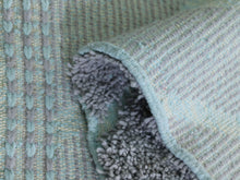 Load image into Gallery viewer, Luxurious handwoven Berber carpet in gray tones.

