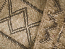 Load image into Gallery viewer, Handwoven Moroccan rug featuring intricate tribal designs.
