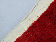 Load image into Gallery viewer, Close-up of the soft texture of a red and pink Moroccan rug.
