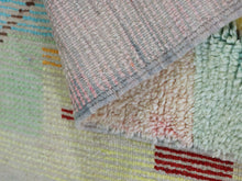 Load image into Gallery viewer, Multicolor Moroccan runner rug styled with ceramic vases in a modern setting.
