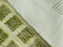 Load image into Gallery viewer, Close-up of the geometric grid pattern and plush wool texture.

