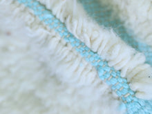 Load image into Gallery viewer, Close-up of the blue grid pattern and plush wool texture.
