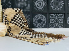 Load image into Gallery viewer, Handwoven Moroccan wool rug featuring earthy tones and geometric patterns.
