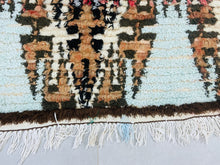 Load image into Gallery viewer, Moroccan wool rug with tribal patterns and soft, rich hues.

