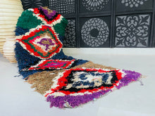 Load image into Gallery viewer, Handwoven Moroccan rug featuring vibrant geometric patterns.
