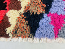 Load image into Gallery viewer, Moroccan rug with colorful triangles perfect for modern or rustic spaces.
