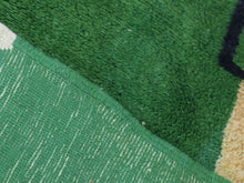 Load image into Gallery viewer, Artistic Berber rug with bold green, blue, and yellow shapes


