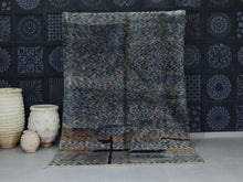 Load image into Gallery viewer, Handmade Moroccan wool rug with dark tones and rustic texture



