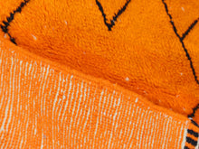 Load image into Gallery viewer, Modern Moroccan area rug in orange with hand-knotted black patterns, perfect for eclectic and bold home decor.


