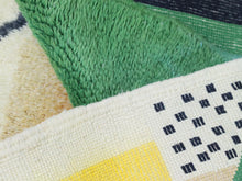Load image into Gallery viewer, Tufted wool rug with expressive color blocking and soft texture


