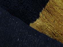 Load image into Gallery viewer, Natural wool rug in golden mustard with thick black edge


