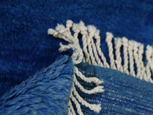 Load image into Gallery viewer, Luxurious handmade Moroccan rug with a bold indigo base and hand-knotted ivory diamonds, ideal for bohemian or modern interiors.



