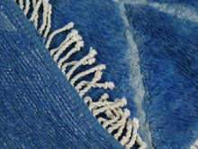 Load image into Gallery viewer, Beni Ourain style Moroccan area rug in blue, with symmetrical diamond motifs and detailed fringe edges for a refined finish.


