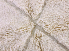 Load image into Gallery viewer, Close-up texture of a Beni Ourain rug showing the plush wool and detailed weave patterns.
