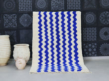 Load image into Gallery viewer, Modern Moroccan wool rug with bold blue and white wavy patterns.

