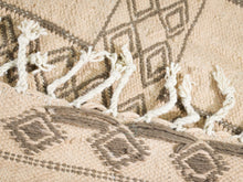 Load image into Gallery viewer, Close-up of detailed geometric patterns on a vintage Moroccan rug.
