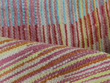 Load image into Gallery viewer, Handwoven chevron rug showcasing pink, blue, and yellow patterns.
