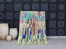 Load image into Gallery viewer, Abstract Moroccan wool rug with multicolor design in blue, green, pink, and brown

