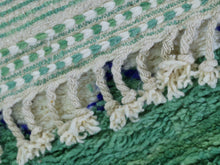 Load image into Gallery viewer, Luxurious wool rug with a bold green and white pattern.
