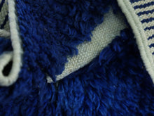 Load image into Gallery viewer, Plush blue Moroccan wool rug texture close-up.
