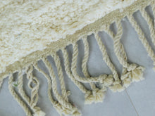 Load image into Gallery viewer, Handmade cream-toned wool rug with subtle patterns.
