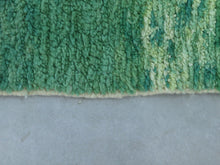 Load image into Gallery viewer, Unique green-toned wool rug for bohemian spaces.
