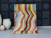 Load image into Gallery viewer, Multicolor Moroccan wool rug with chevron design in vibrant hues.

