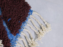 Load image into Gallery viewer, Handmade Moroccan wool rug with tribal blue line details


